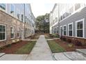 Shared courtyard with landscaping and walkways between townhomes at 4007 Bourne Ct # Lot 42, Charlotte, NC 28262