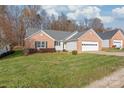 Ranch home with a two-car garage and a spacious front yard at 914 Hidden Creek Cir, Salisbury, NC 28147