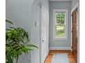 Bright entryway with hardwood floors, a window, and a light blue rug at 2016 Winter St, Charlotte, NC 28205