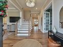 Bright and spacious entryway with hardwood floors and staircase at 1426 Porch Wisdom Ct, Fort Mill, SC 29708