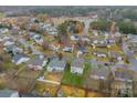 Aerial view of a neighborhood with houses and trees at 171 Kristens Court Dr, Mooresville, NC 28115