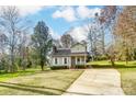 Quaint house with a spacious yard and a long driveway at 3040 Wagonwheel Ct, Belmont, NC 28012