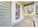 Inviting front porch with white railings and a view of the backyard at 3040 Wagonwheel Ct, Belmont, NC 28012