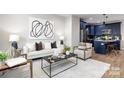 Bright living room with an open floor plan and neutral color palette at 310 Town St, Landis, NC 28088