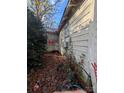 View of the home's side, showing additional details of the house and yard at 636 Harrison Sanders Ln, Lincolnton, NC 28092