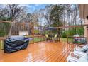 Spacious deck with seating area and grill at 8214 Addison Dr, Harrisburg, NC 28075