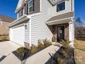 Front entrance with stone accents and landscaping at 15533 Capps Rd, Charlotte, NC 28278