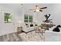 Bright living room with white couch and a modern feel at 1504 E Cole St, Gastonia, NC 28054