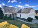 Two-story house with stone accents and a well-maintained lawn at 2123 Hartwell Ln, Fort Mill, SC 29707