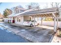 Carport next to a charming house with a snow-covered roof at 241 4Th N Ave, Taylorsville, NC 28681