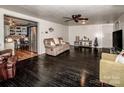 Spacious living room with dark hardwood floors and a view of the kitchen at 241 4Th N Ave, Taylorsville, NC 28681