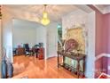 Elegant entryway with hardwood floors, a decorative wall, and a console table at 6071 Underwood Ave, Charlotte, NC 28213