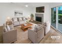 Virtually staged living room featuring fireplace and hardwood floors at 5003 Sharon Rd # S, Charlotte, NC 28210