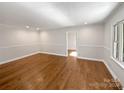 Spacious living area with hardwood floors and neutral wall colors at 104 Abingdon Cir, Huntersville, NC 28078