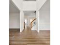 Bright entryway with hardwood floors and staircase at 1805 Lexington Ave, Monroe, NC 28112