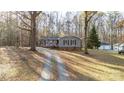 Gray house nestled in a wooded area with a long driveway at 4477 Pinebrook Dr, Rock Hill, SC 29730