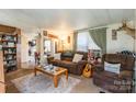 Cozy living room featuring a brown sofa and coffee table at 5175 Liberty Hill W Rd, York, SC 29745