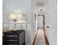 Bright hallway with wainscoting and a stylish runner at 12128 Robins Nest Ln, Charlotte, NC 28269