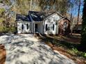 House exterior showcasing a driveway and landscaping at 1812 Winfield Dr, Monroe, NC 28110