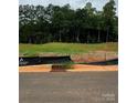 Vacant lot with trees and partially cleared land at 3952 Ashton Nw Dr, Conover, NC 28613