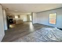 Open living space with kitchen and island, featuring laminate flooring at 46 Kidd And Brown Rd, Hiddenite, NC 28636