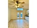 Bright living room featuring hardwood floors and sliding glass doors to patio at 6130 Heathstone Ln, Charlotte, NC 28210