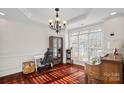 Elegant dining room with hardwood floors and large windows at 10113 Allison Taylor Ct, Cornelius, NC 28031