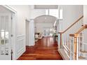 Bright and spacious entryway with hardwood floors and staircase at 10113 Allison Taylor Ct, Cornelius, NC 28031