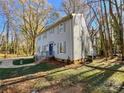 Two-story house with gray siding, showcasing its side profile and landscaping at 2117 Arden Dr, Monroe, NC 28112