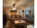 Cozy living room featuring a wood-burning stove and comfortable seating at 369 Pinecrest Cir, Troy, NC 27371