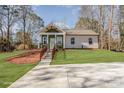 House exterior showcasing a green and white color scheme, steps, and landscaping at 2503 Parnell Dr, Shelby, NC 28150