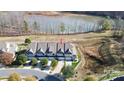 Aerial view of a townhome community near a lake, highlighting the subject property at 4146 La Crema Dr, Charlotte, NC 28214