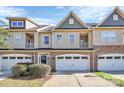 Three-story townhome with a neutral color palette and attached garages at 4146 La Crema Dr, Charlotte, NC 28214