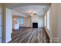 Open living room showcasing hardwood floors and a view into the kitchen at 9605 Pointer Rd # 78, Huntersville, NC 28078