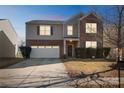 Two-story brick home with a two-car garage, nighttime view at 11828 Bending Branch Rd # 42, Charlotte, NC 28227