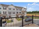 Townhome community view from a balcony, showing homes and parking at 1725 Aspire St, Charlotte, NC 28262