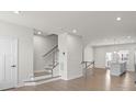 Bright living room with hardwood floors and staircase at 1725 Aspire St, Charlotte, NC 28262