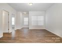 Bright and airy living room with hardwood floors and neutral walls at 371 Kona Ln, Indian Trail, NC 28079