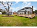 Spacious backyard with a large deck, detached garage and shed at 8823 Dartmoor Pl, Mint Hill, NC 28227