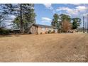 Side view of brick ranch house, ample yard space at 906 S Cherry Rd, Rock Hill, SC 29732