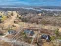 An aerial view showcasing the property's location near a golf course and lake at 1115 Stony Point Rd, Kings Mountain, NC 28086