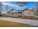 The home's front exterior features a welcoming front porch and landscaped yard at 1115 Stony Point Rd, Kings Mountain, NC 28086