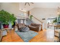 Spacious living room with hardwood floors, two couches and a staircase at 15215 Timberview Ln, Huntersville, NC 28078