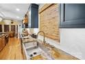 Kitchen with stainless steel sink, granite countertops, and bamboo shades at 190 Poplar Grove Rd, Mooresville, NC 28117