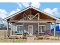 Gray craftsman style home with a covered porch and landscaped yard at 212 Tournament Sw Dr, Concord, NC 28025