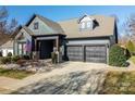 Two-story house with gray siding, two-car garage, and American flag at 2221 Lexington St, Belmont, NC 28012