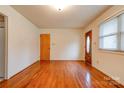 Living room featuring hardwood floors and wood door at 302 Churchill Dr, Kings Mountain, NC 28086