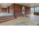 Brick back porch with access to the backyard at 5660 Sherrills Ford Rd, Salisbury, NC 28147