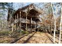 Multi-level log cabin home with expansive decks and wooded views at 633 Weston Acres Rd, Fort Lawn, SC 29714