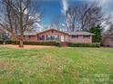 Ranch style brick home with large yard at 7218 Melody Ln, Charlotte, NC 28214